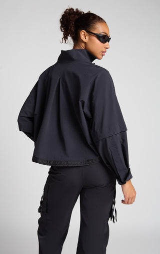 Woman wearing SENIQ Dirtpop Trek Jacket and Trailmix Pants