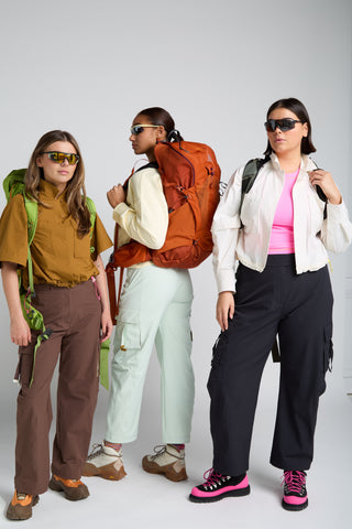 Group of women wearing SENIQ Technical Outdoor Gear. Trailmix Pant Trail System including Dirtpop Trek Jacket and Oasis Tank
